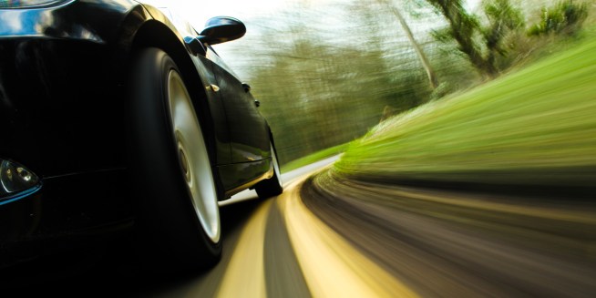 car-driving-down-road